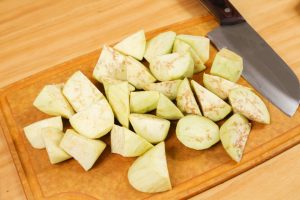 Prep the Veggies: Wash the eggplants and cut them into rolling chunks. Mince the garlic.