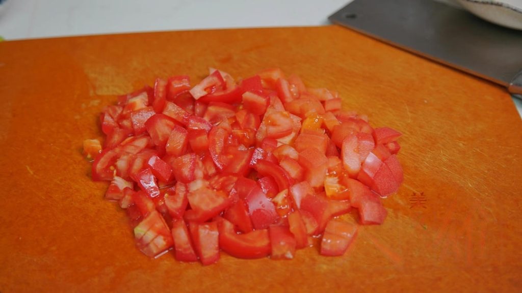 Slice your tomatoes into small cubes.