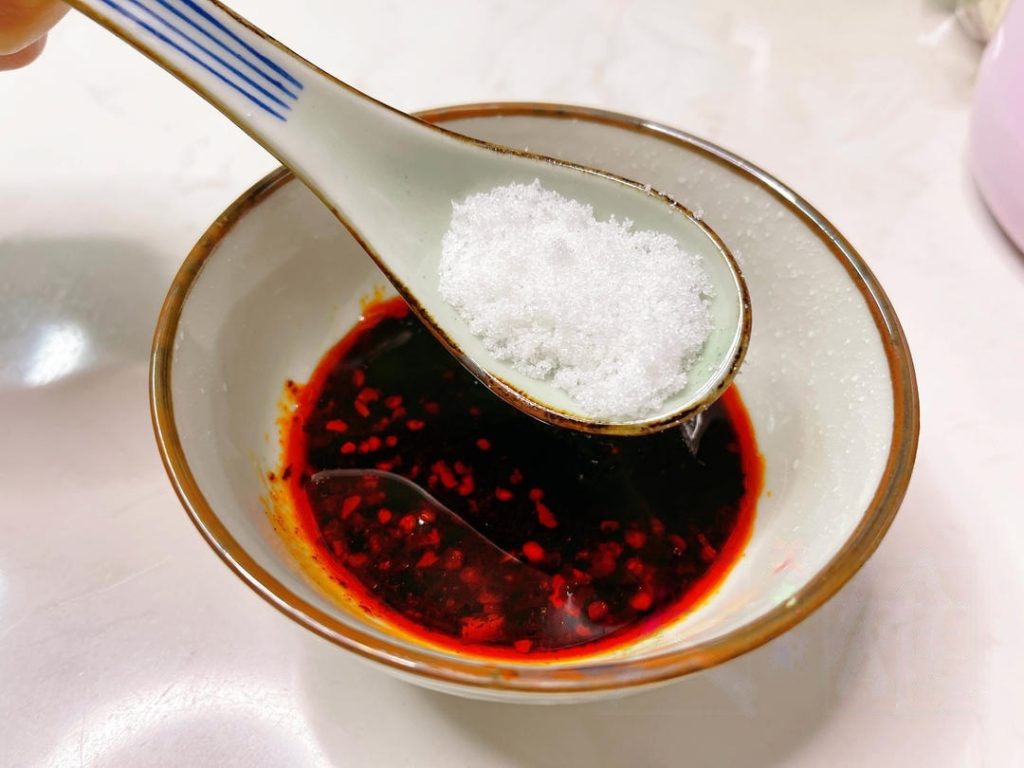In a small bowl, mix the sauce ingredients: light soy sauce, vinegar, oyster sauce, chili crisp, salt, and sugar.