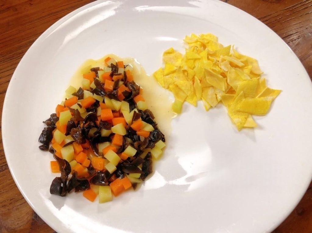 Add a splash of water and the wood ear mushrooms. Cook for about 3 minutes until the potatoes are tender. Season with a pinch of salt. Set aside.