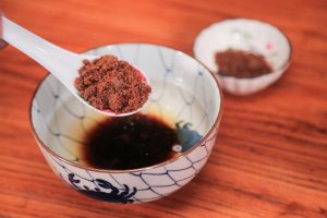 While the jelly sets, prepare the syrup. Combine the brown sugar with hot water.