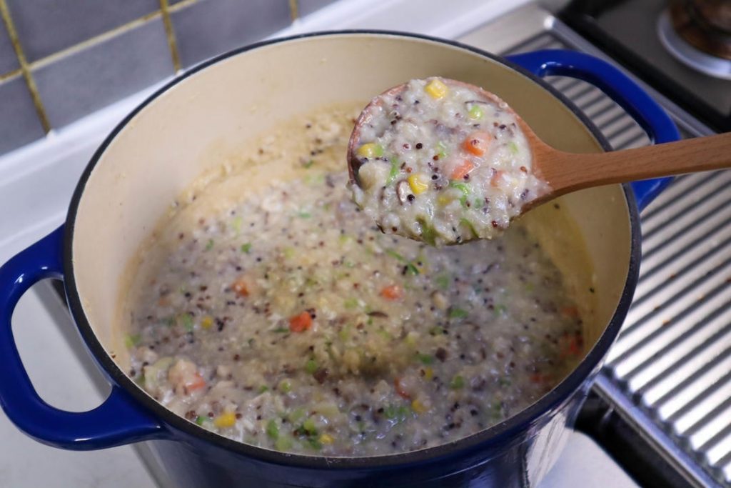 Pour the whole egg into the bubbling porridge.