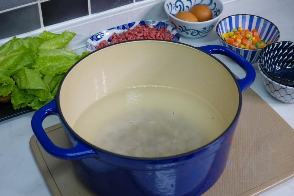 Place them in a pot and add about 10 times the volume of water. (e.g., if you have 1/2 cup of grains, use 5 cups of water)