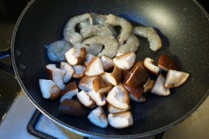 Seasoning (The "Dump" Method) In the unheated pan containing the shrimp and mushrooms