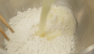 Boil the Liquids: In a medium saucepan, combine the 100g butter and 200g water. Bring this to a rolling boil. Why? We need the heat to cook the flour instantly (the scalding method).