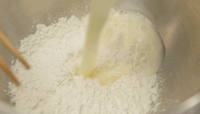 Boil the Liquids: In a medium saucepan, combine the 100g butter and 200g water. Bring this to a rolling boil. Why? We need the heat to cook the flour instantly (the scalding method).