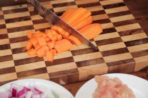 Mise en Place Cut the carrot, chicken, and onion into small, bite-sized cubes. Cut the broccoli into small florets. Mince the garlic. Have your curry cubes ready.