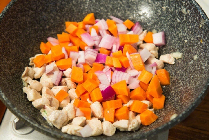 Add Root Vegetables Add the carrots and onions to the pot. Stir-fry for 2-3 minutes until the onions begin to turn translucent and the carrots soften slightly.