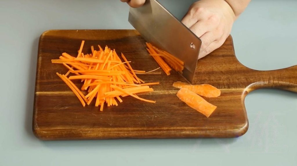 Cut the Vegetables: Slice the onion into thin strips. Julienne the carrot (cut into matchsticks). Cut the celery into thin strips similar in size to the carrots.