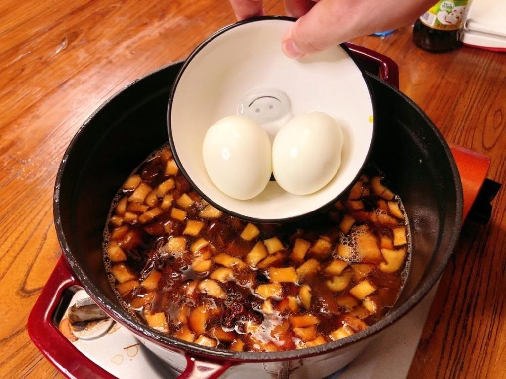 Add the peeled hard-boiled eggs now so they can soak up the flavor.