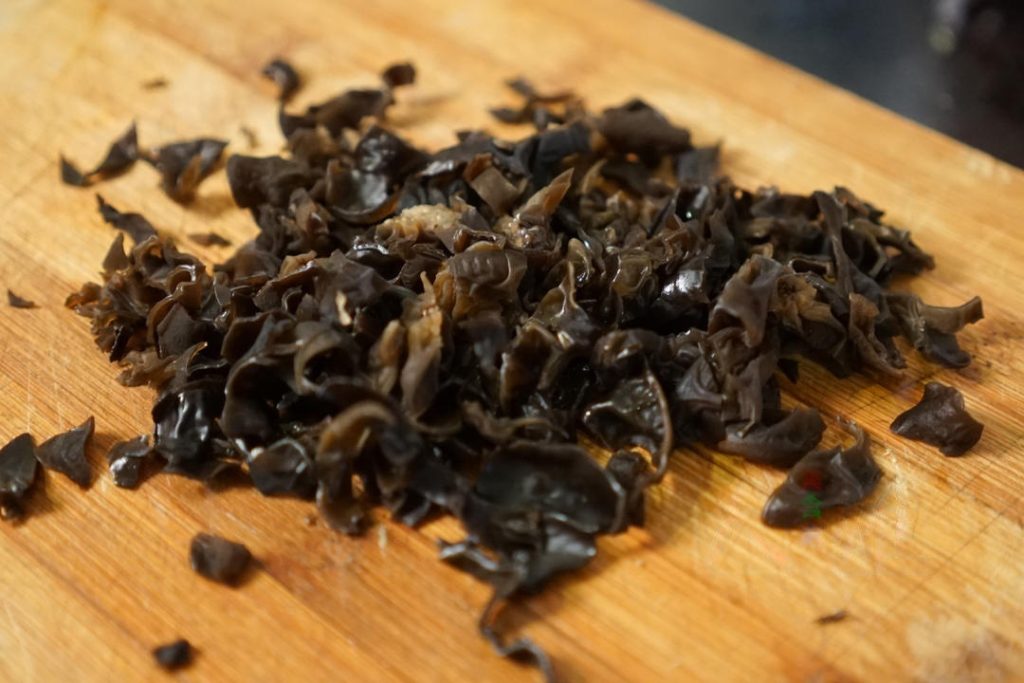 soak your wood ear mushrooms in warm water until soft. Wash them thoroughly and slice them into thin strips.
