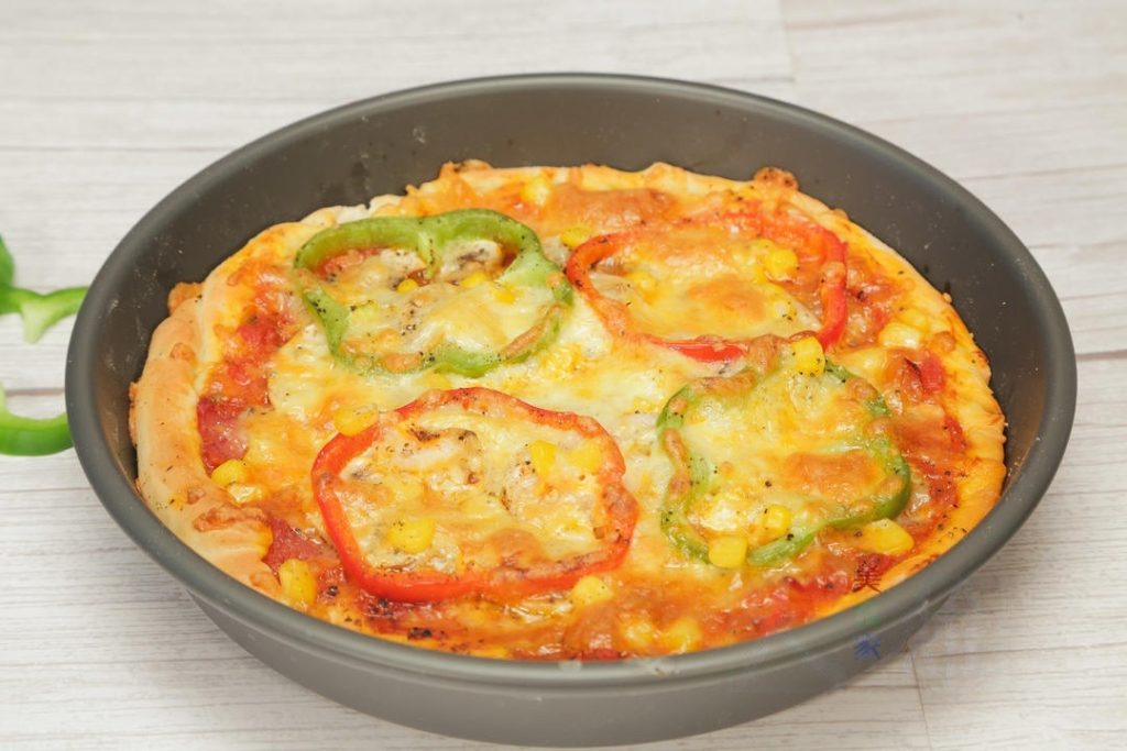 and vegetables evenly. Top with a thick layer of the remaining mozzarella cheese.