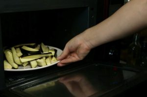 Prep the Eggplant: Cut 2 long eggplants into segments, then into strips. Spread them on a microwave-safe plate and microwave on high for 6-9 minutes until soft.