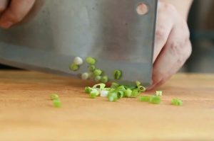 Aromatics: Mince the scallion (white part), ginger (1 small chunk), and garlic (5 cloves). Slice the Thai chili (Millet pepper) into rings.