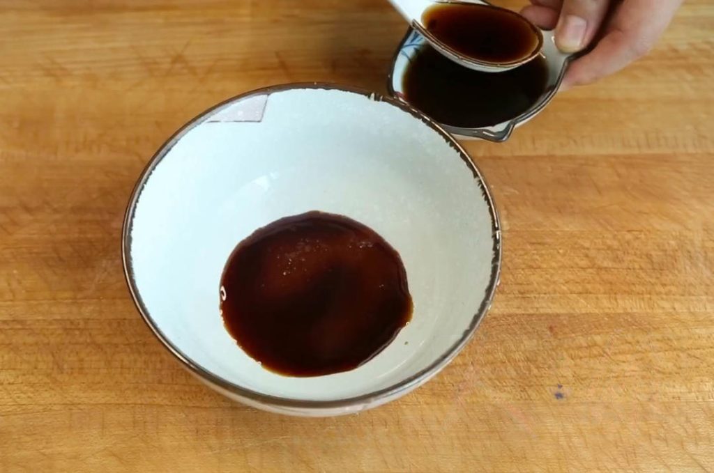 The Sauce: In a bowl, mix 2 tbsp sugar, 2 tbsp Light Soy Sauce, 3 tbsp Chinkiang Vinegar, 1/2 cup water, and half of the minced garlic and ginger. Stir to dissolve the sugar.