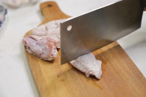 Use a knife to make two shallow slits on both sides of each chicken wing