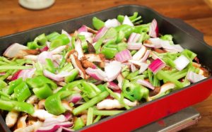 Layer the Vegetables: Uncover. The broth should be rich and bubbling. Layer the celery, peppers, onions, and mushrooms on top of the chicken. Do not stir yet. Cover the pot again and let it simmer (steam-braise) for 5 minutes.