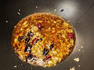Give your sauce a quick stir (starch settles at the bottom) and pour it into the pan.
