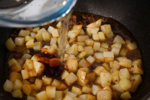 Pour in enough water to just cover the potatoes (about 1 cup).