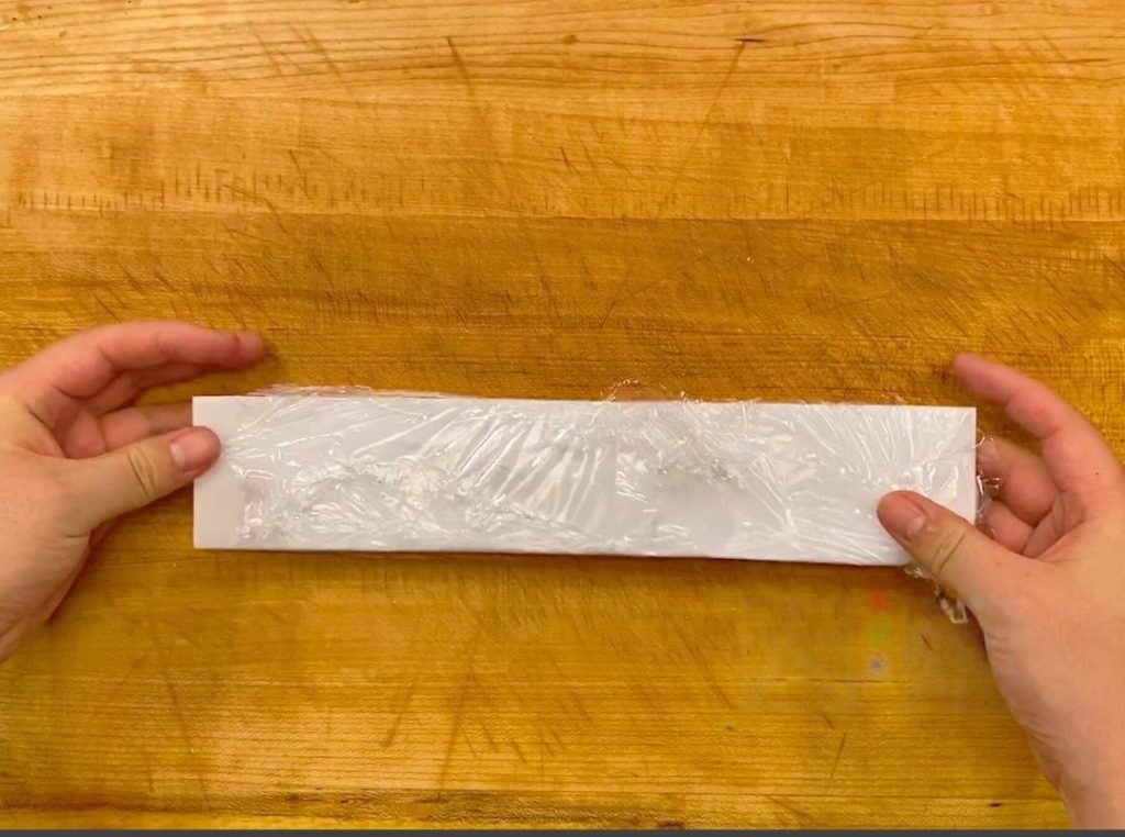 To get that perfect restaurant cylinder shape, you can use a round cookie cutter or a ring mold. Press the shrimp ball into the mold using a piece of carrot or cucumber dipped in oil to flatten it into a uniform cake.