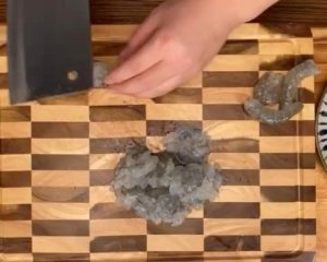 Then, use the back of the knife to "chop" it into a mud-like paste.