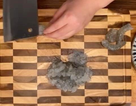 Then, use the back of the knife to "chop" it into a mud-like paste.