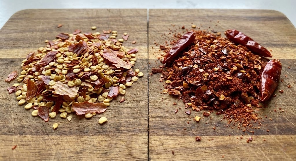 Comparison of Italian pizza pepper flakes vs authentic vibrant red Sichuan chili flakes.