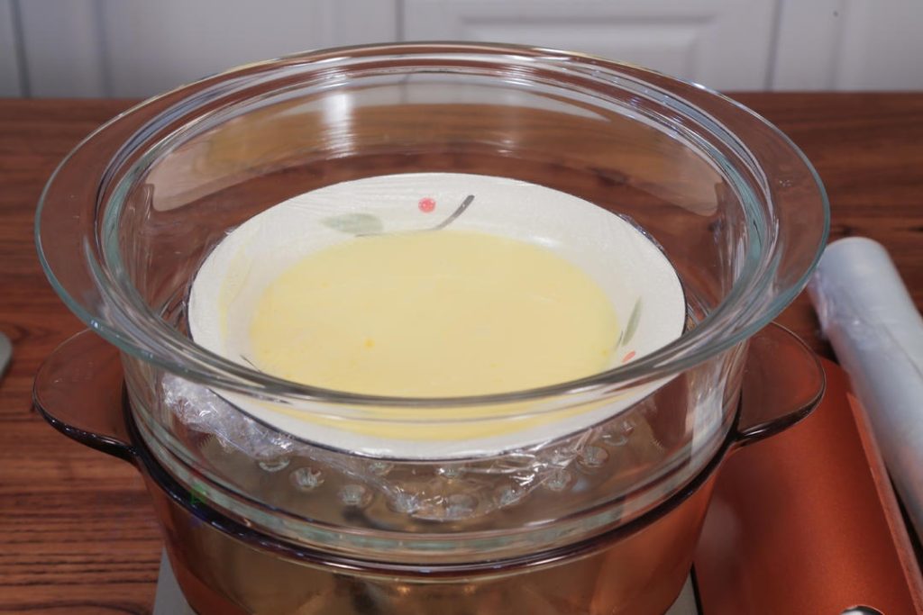 Pour the egg mixture into your heat-proof serving bowl or deep dish. Cover the bowl tightly with plastic wrap. Use a toothpick to poke 1 or 2 tiny holes in the wrap to release excess pressure.