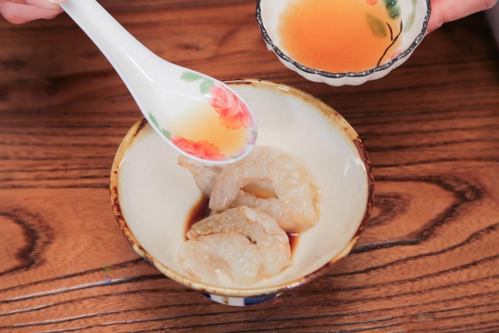 Place the blanched shrimp in a small bowl and toss with the Shaoxing wine, ½ tsp light soy sauce, and a pinch of salt.