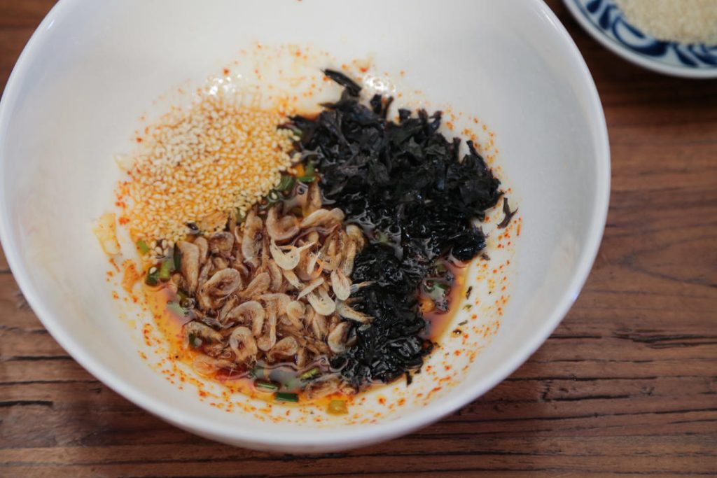 The Base: Add the soy sauce, vinegar, dried seaweed, and papery shrimp to the bowl. Stir well to combine.