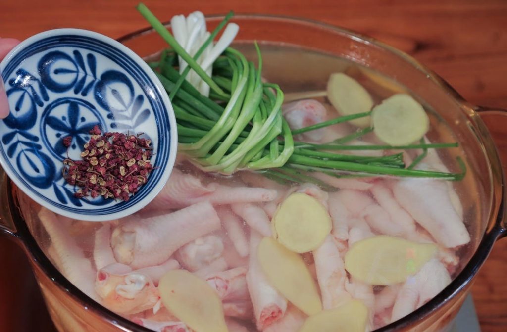 Blanch the Meat: Place the chicken feet and wings in a large pot and cover with cold water.