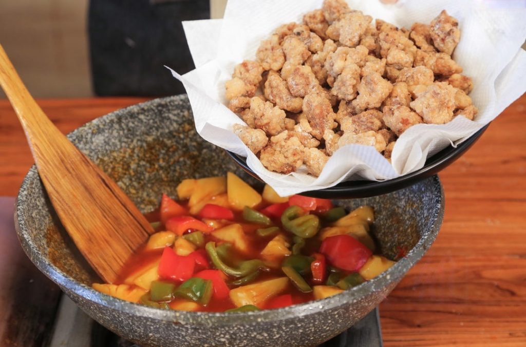 Finally, dump in the fried pork, peppers, and pineapple.