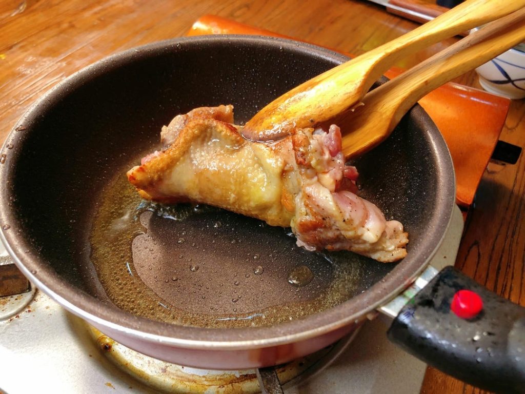 Flip: Pan-fry slowly until the chicken skin is golden brown and crispy (about 4-5 minutes). Flip the chicken over.