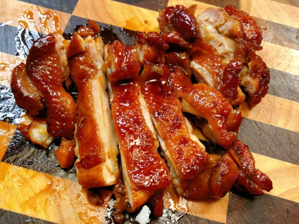 Serve: Remove the chicken and slice it into strips.