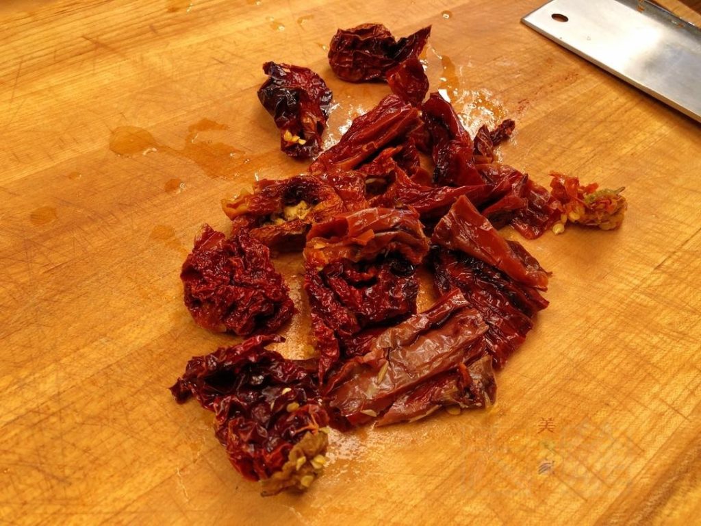 Chilies: Soak the 4 dried chilies (or more if you like it hot) in cold water until soft. Drain, squeeze out excess water, and chop into segments.