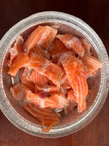 Prepare the Fish Thoroughly wash the salmon bones under cold water to remove any blood. Pat them extremely dry with paper towels. Water is the enemy of crispiness. Cut the bones into segments that fit comfortably in your air fryer basket.