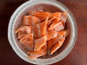 Step 3: Air Fry Preheat your air fryer to 360°F (180°C). Place the foil tray with the salmon into the basket. Cook for 20 minutes.