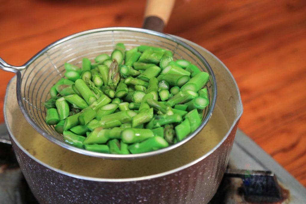 Blanch the Vegetables: Bring a pot of water to a boil and add a pinch of salt (this keeps veggies green).