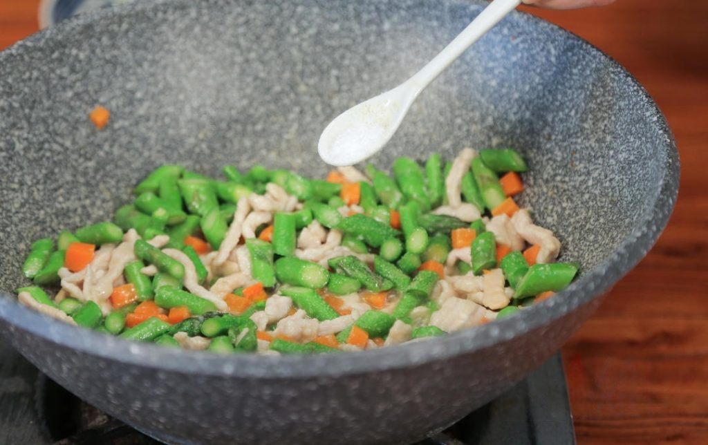 Season: Once the alcohol smell evaporates, add 1 tablespoon of Light Soy Sauce, the sugar, salt, and MSG (if using).
