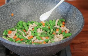 Season: Once the alcohol smell evaporates, add 1 tablespoon of Light Soy Sauce, the sugar, salt, and MSG (if using).