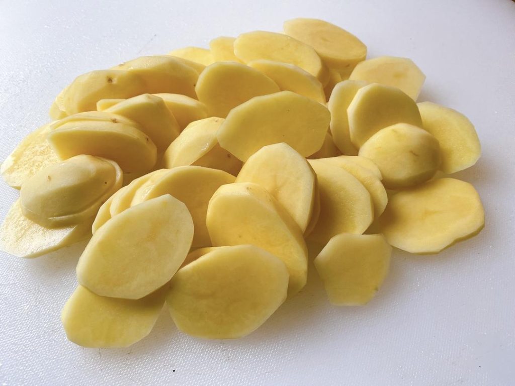 Slice: Cut the potatoes into slices about 1/4-inch (0.5 cm) thick. Crucial Tip: Do not rinse the potato slices after cutting them. We want to keep the natural starches on the surface to help them brown in the pan.