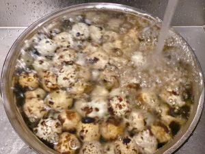 Using a slotted spoon, immediately transfer the cooked quail eggs into a large bowl filled with cold water (ice water is even better). Let them sit for 5 minutes.