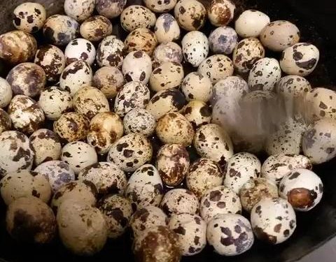 Once the eggs are cool enough to handle, use the back of a metal spoon to gently tap the shells all over. Do not peel them. You want the shell covered in a fine web of cracks. The more intricate the cracks, the more beautiful the marbled pattern will be once they are braised.