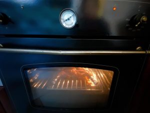 Roast (First Phase): Lower the oven temperature to 200°C (400°F). Place the chicken in the lower-middle rack of the oven and roast for 30 minutes.