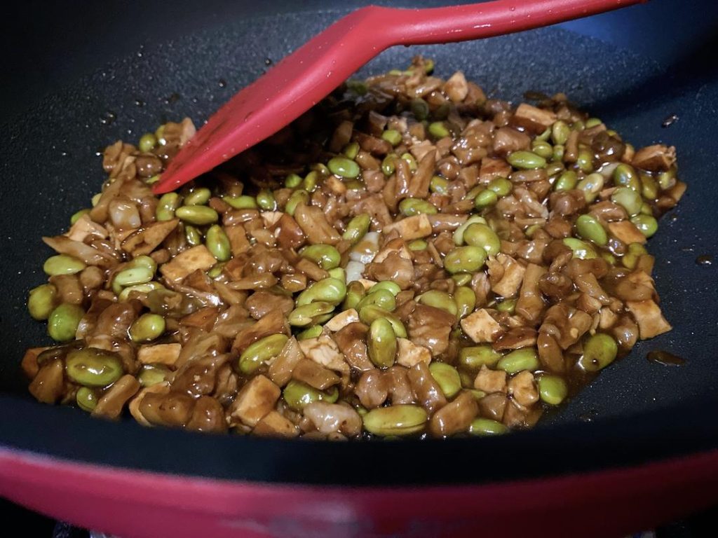 Glaze with Sauce (1–2 minutes): Give your sauce mixture a quick stir to lift any settled cornstarch from the bottom of the bowl, then pour it over the ingredients in the wok.