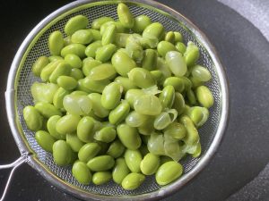 Boil the Beans (10 minutes): Place the green soybeans in a pot with cold water. Bring to a boil and cook for about 10 minutes until tender. (If using a pressure cooker or heavy-lidded pot, this time will be shorter). Drain well and set aside.