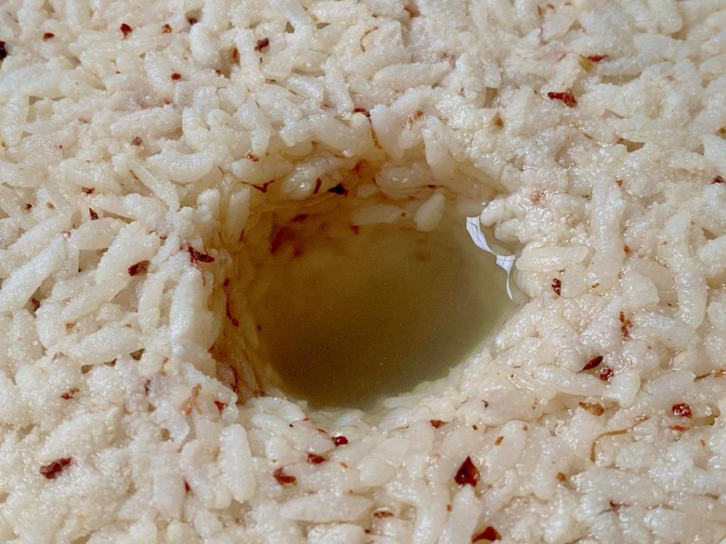 Observe and Chill: After about 36 hours, check the hole. It should be filled with sweet, fragrant rice wine. White fuzz on the surface is a normal byproduct of the Rhizopus fungus. Once it reaches your desired sweetness, move it to the refrigerator to halt fermentation.
