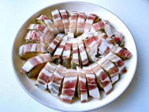 Assemble (5-10 minutes): Carefully tuck one thin slice of salted pork into each cut you made in the eel. Lay any remaining pork slices on top.