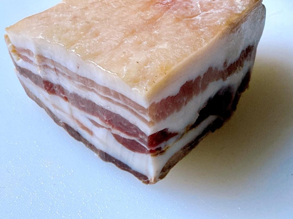 Assemble (5-10 minutes): Carefully tuck one thin slice of salted pork into each cut you made in the eel. Lay any remaining pork slices on top.