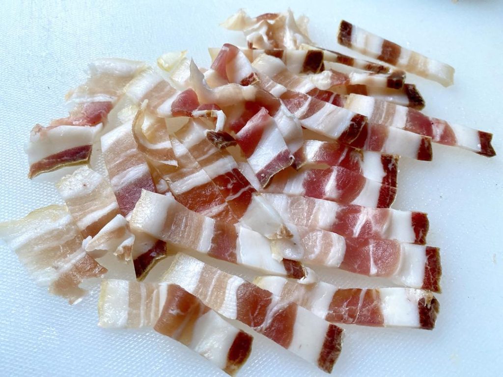 Assemble (5-10 minutes): Carefully tuck one thin slice of salted pork into each cut you made in the eel. Lay any remaining pork slices on top.